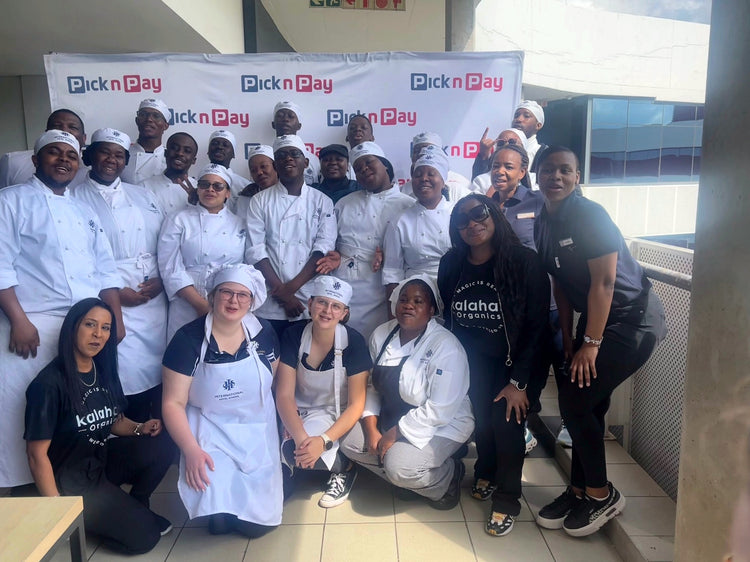 A large group of chefs and the Kalahari Organics team at a cooking event