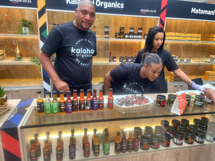 The Kalahari Organics team behind their pop-up counter of hot sauces and chilli crunch
